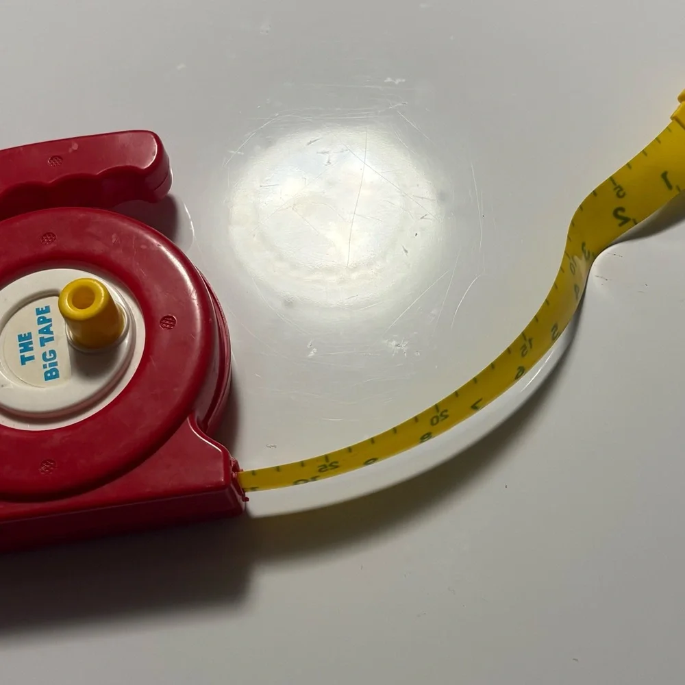 Red Measuring Tape with Yellow Tape